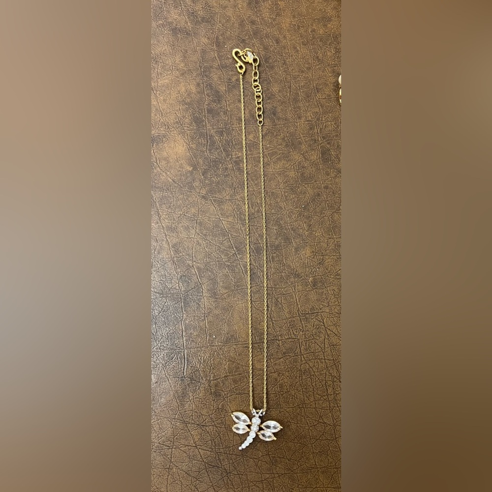 Costume Gold colored chain and Crystal type dragonfly . 9” diameter.